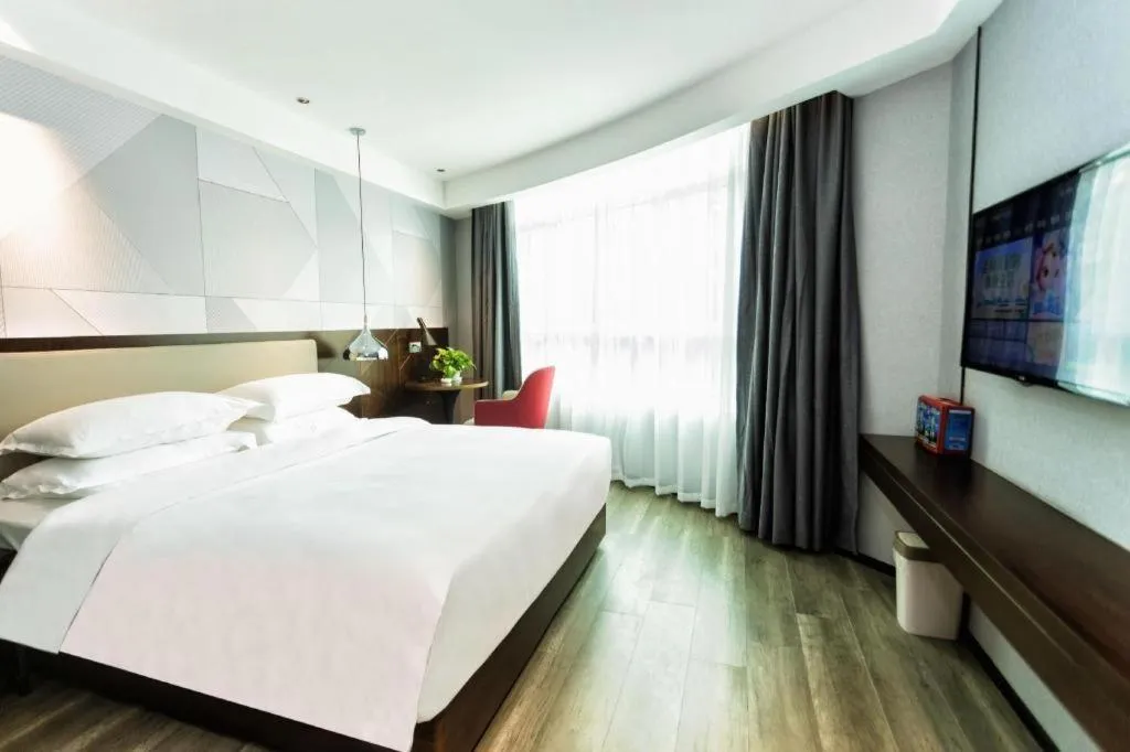 Bed in Borrman Hotel Yunfu Xinxing County Bus Station