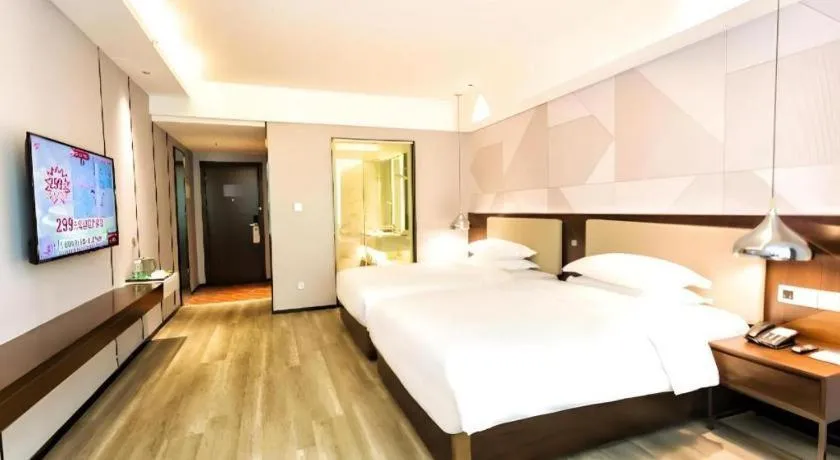 Bed in Borrman Hotel Yunfu Xinxing County Bus Station