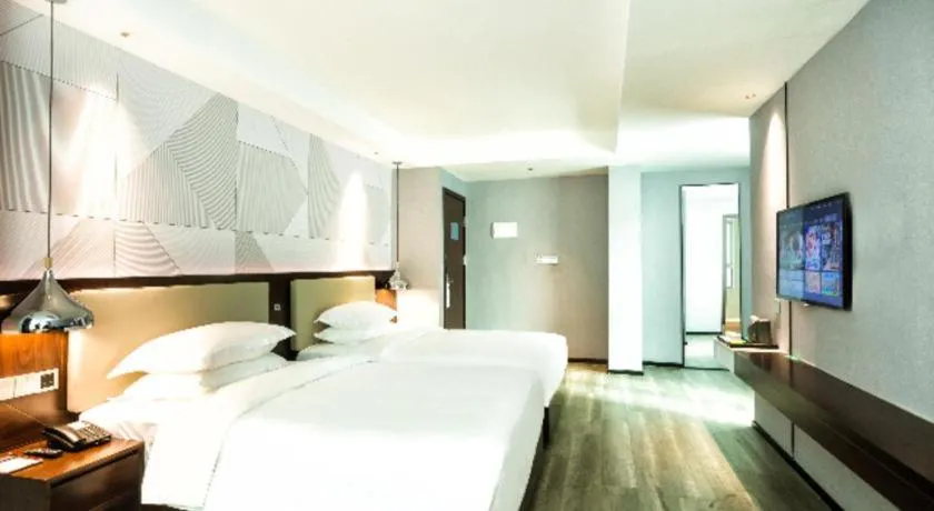 Bed in Borrman Hotel Yunfu Xinxing County Bus Station