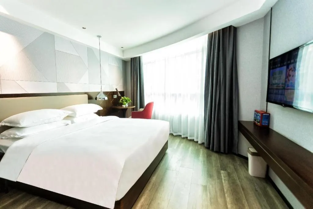 Bed in Borrman Hotel Yunfu Xinxing County Bus Station