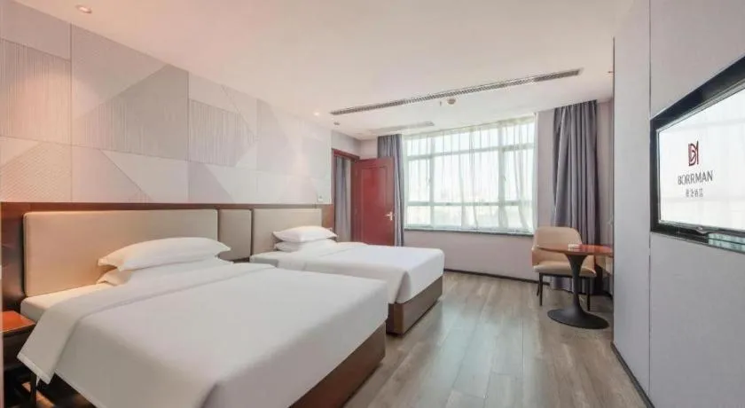 Bed in Borrman Hotel Yunfu Xinxing County Bus Station