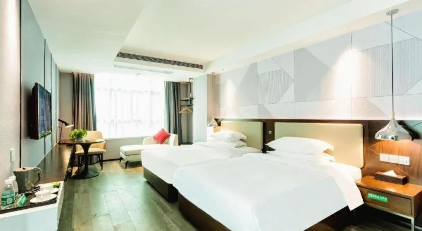 Bed in Borrman Hotel Yunfu Xinxing County Bus Station