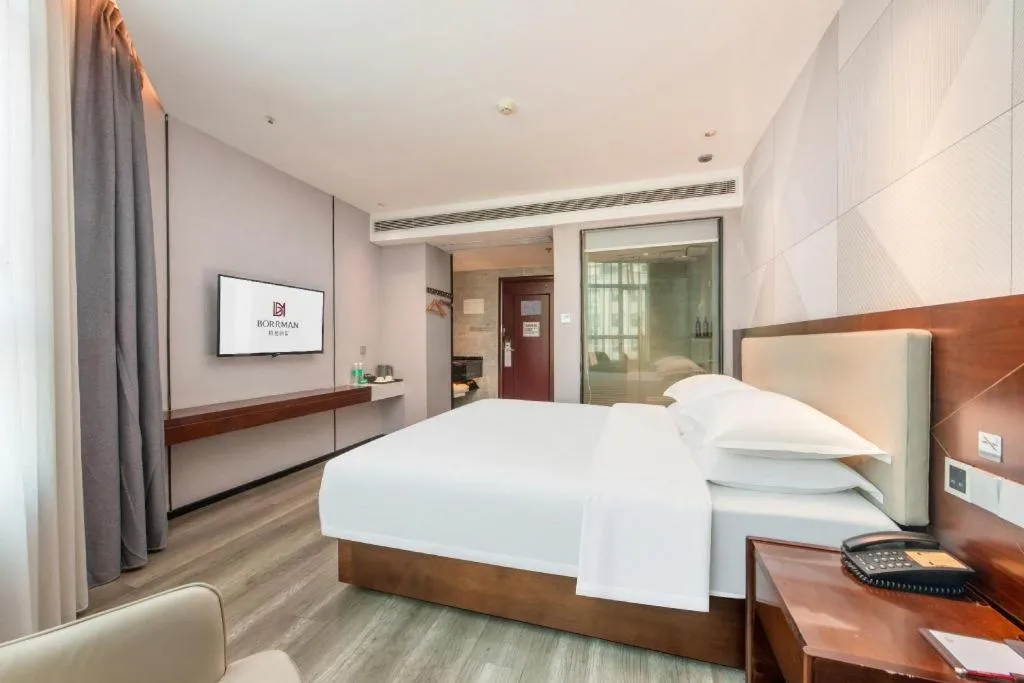 Bed in Borrman Hotel Yunfu Xinxing County Bus Station