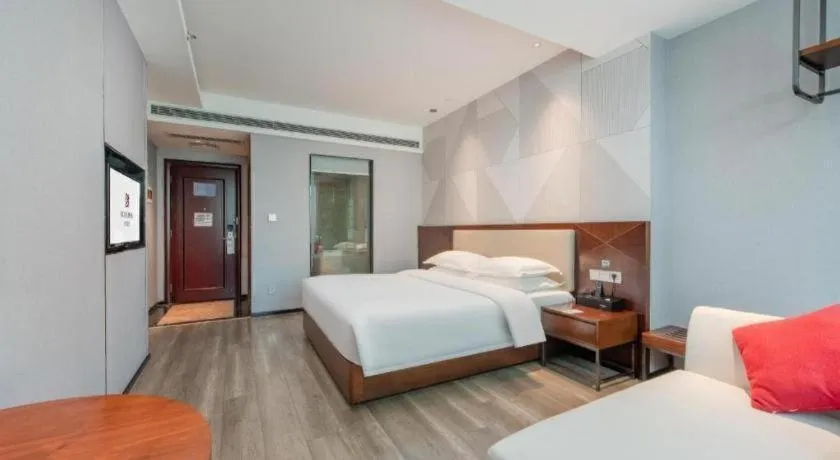 Bed in Borrman Hotel Yunfu Xinxing County Bus Station