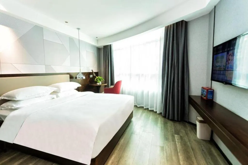 Bed in Borrman Hotel Yunfu Xinxing County Bus Station