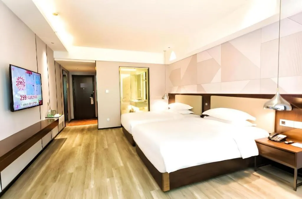 Bed in Borrman Hotel Yunfu Xinxing County Bus Station