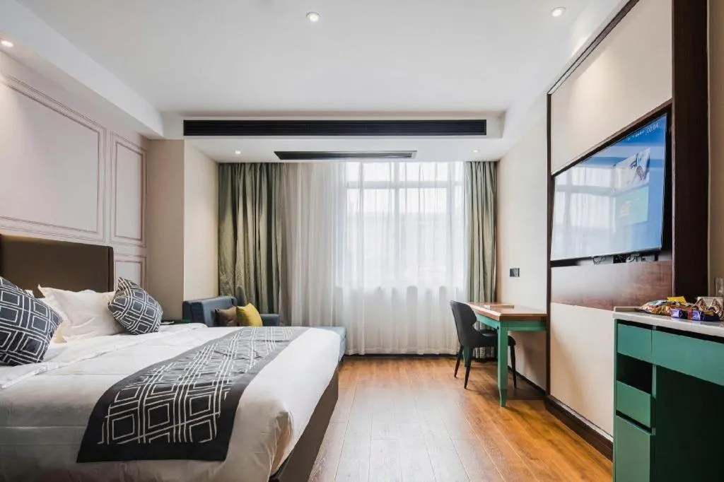 Bed in GEM Hotel Changzhou Xuejia'aoyuan North High-Speed Railway Station