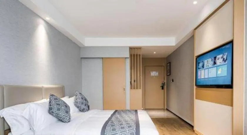 Bed in GEM Hotel Changzhou Xuejia'aoyuan North High-Speed Railway Station