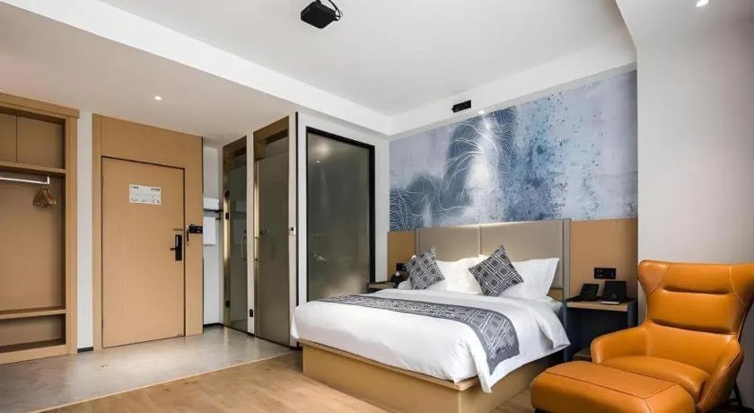 Bed in GEM Hotel Changzhou Xuejia'aoyuan North High-Speed Railway Station