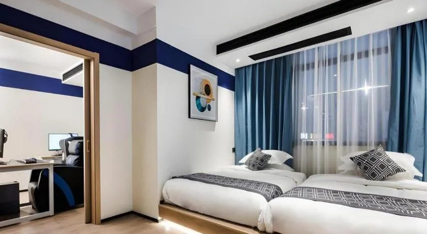 Bed in GEM Hotel Changzhou Xuejia'aoyuan North High-Speed Railway Station