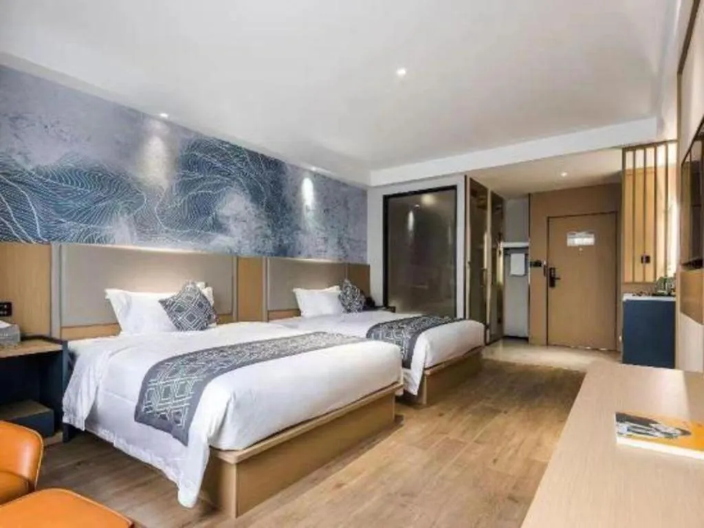 Bed in GEM Hotel Changzhou Xuejia'aoyuan North High-Speed Railway Station