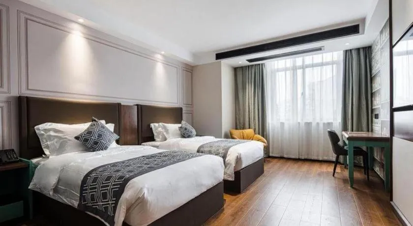 Bed in GEM Hotel Changzhou Xuejia'aoyuan North High-Speed Railway Station