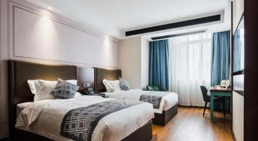 Bed in GEM Hotel Changzhou Xuejia'aoyuan North High-Speed Railway Station