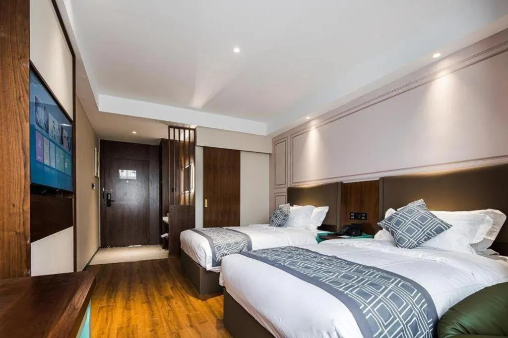 Bed in GEM Hotel Changzhou Xuejia'aoyuan North High-Speed Railway Station