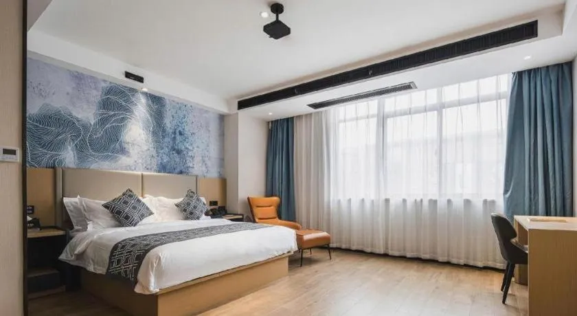 Bed in GEM Hotel Changzhou Xuejia'aoyuan North High-Speed Railway Station