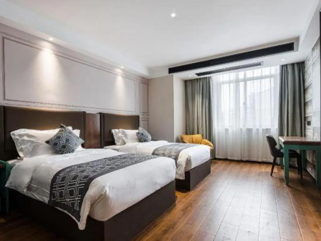 Bed in GEM Hotel Changzhou Xuejia'aoyuan North High-Speed Railway Station