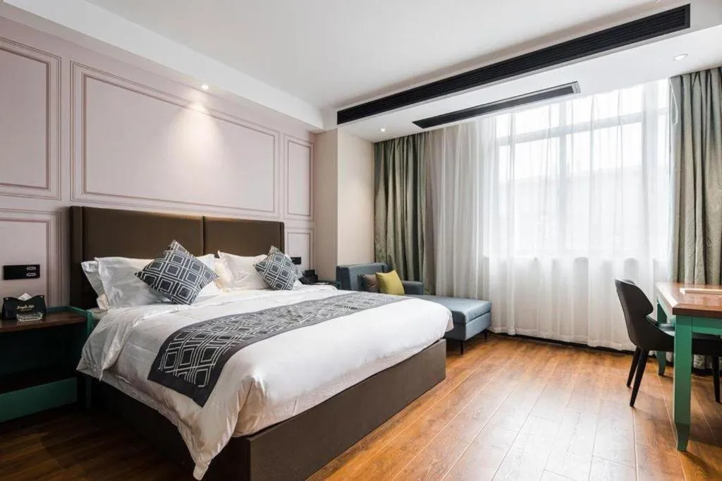 Bed in GEM Hotel Changzhou Xuejia'aoyuan North High-Speed Railway Station