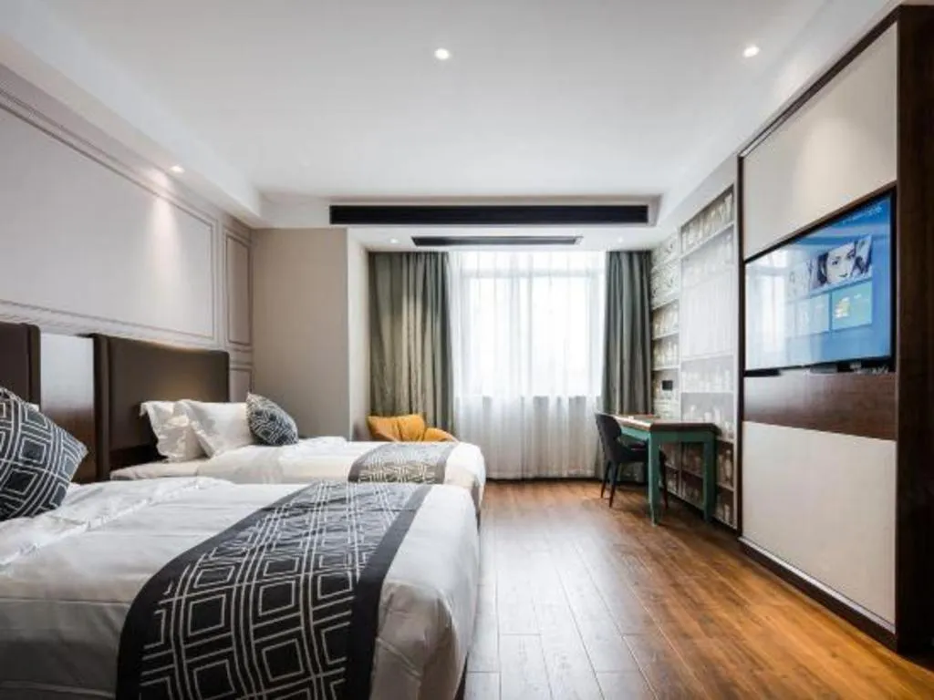 Bed in GEM Hotel Changzhou Xuejia'aoyuan North High-Speed Railway Station