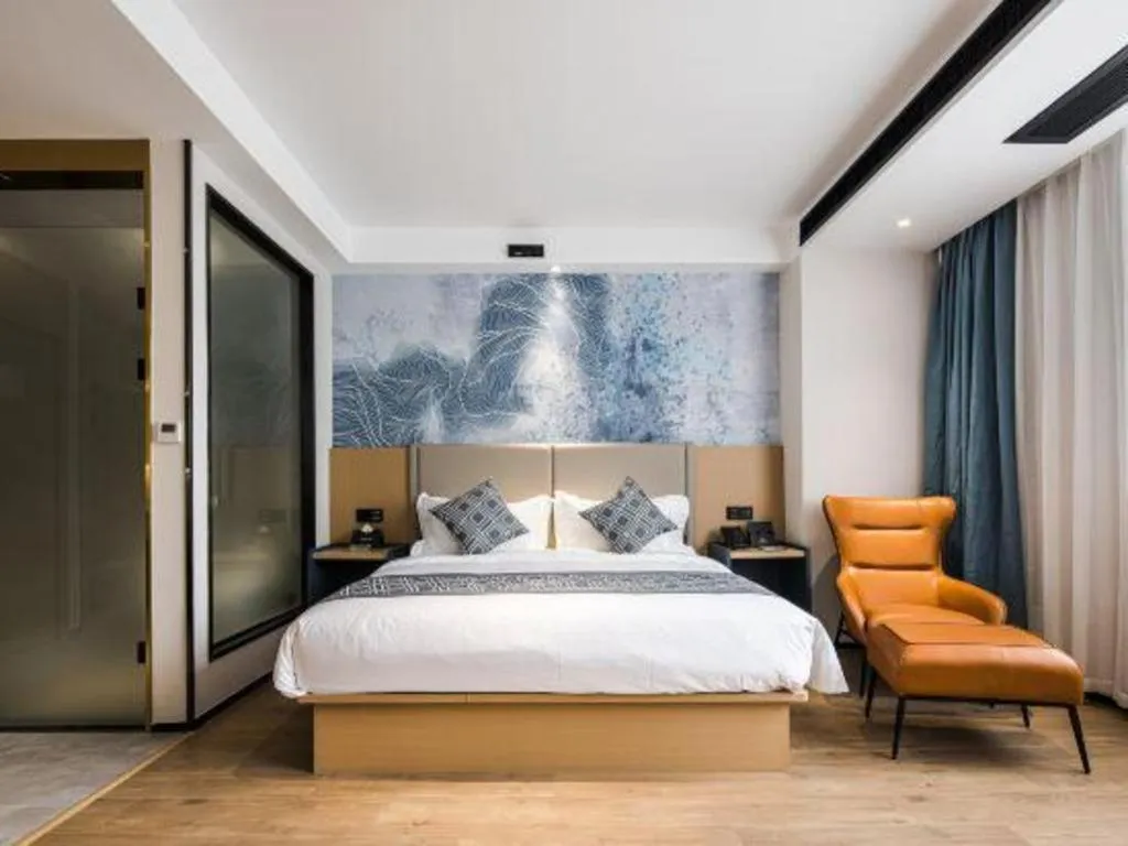 Bed in GEM Hotel Changzhou Xuejia'aoyuan North High-Speed Railway Station