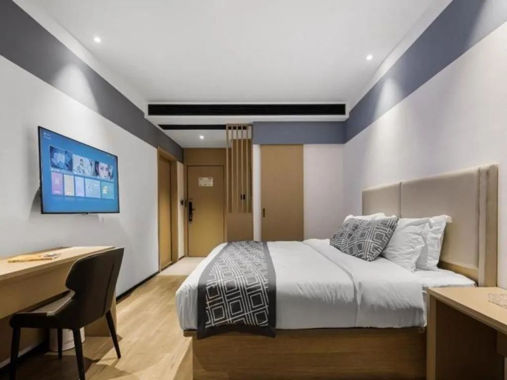 Bed in GEM Hotel Changzhou Xuejia'aoyuan North High-Speed Railway Station