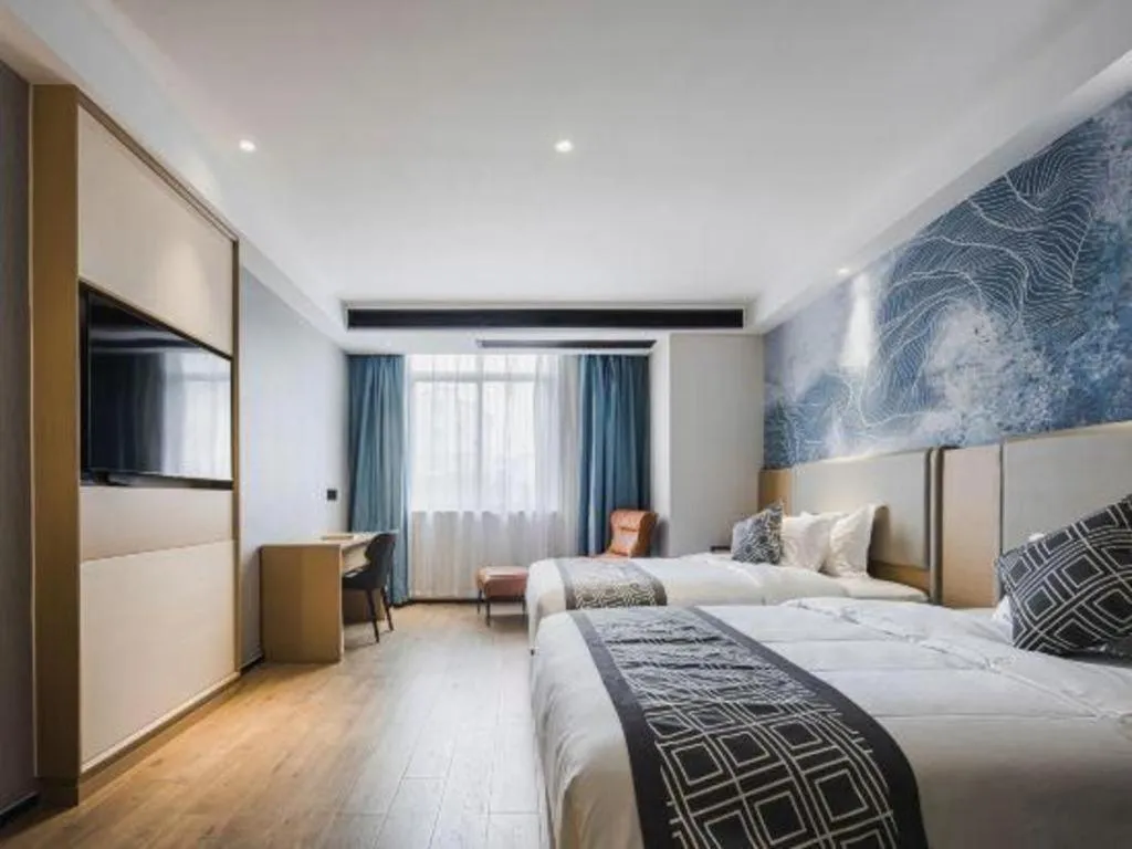 Bed in GEM Hotel Changzhou Xuejia'aoyuan North High-Speed Railway Station