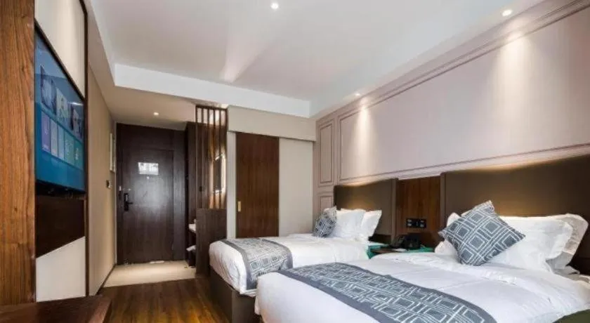 Bed in GEM Hotel Changzhou Xuejia'aoyuan North High-Speed Railway Station