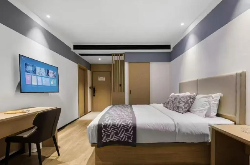 Bed in GEM Hotel Changzhou Xuejia'aoyuan North High-Speed Railway Station