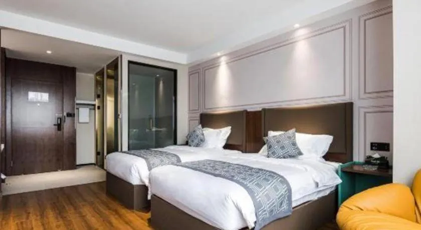 Bed in GEM Hotel Changzhou Xuejia'aoyuan North High-Speed Railway Station