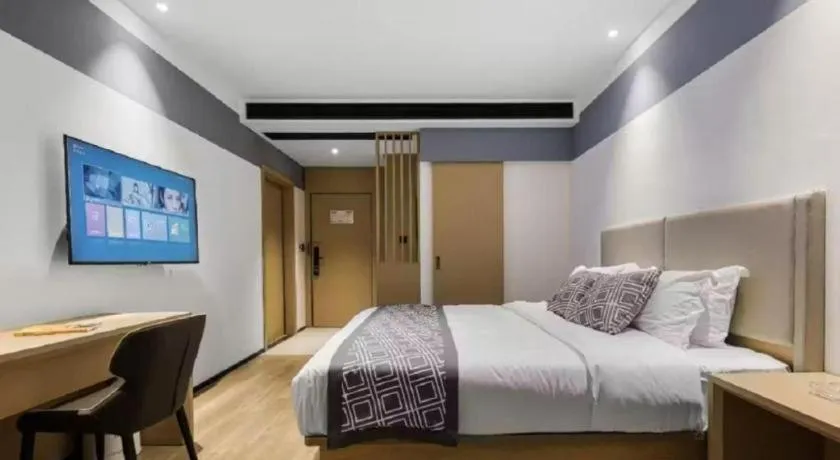 Bed in GEM Hotel Changzhou Xuejia'aoyuan North High-Speed Railway Station