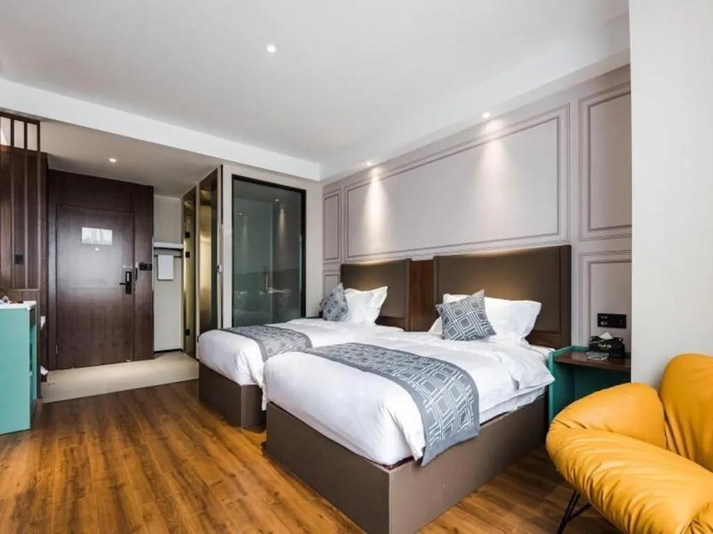 Bed in GEM Hotel Changzhou Xuejia'aoyuan North High-Speed Railway Station