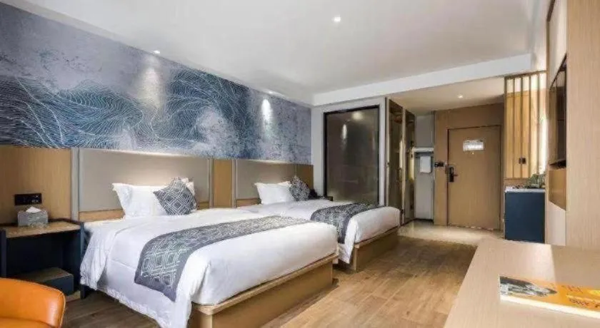 Bed in GEM Hotel Changzhou Xuejia'aoyuan North High-Speed Railway Station