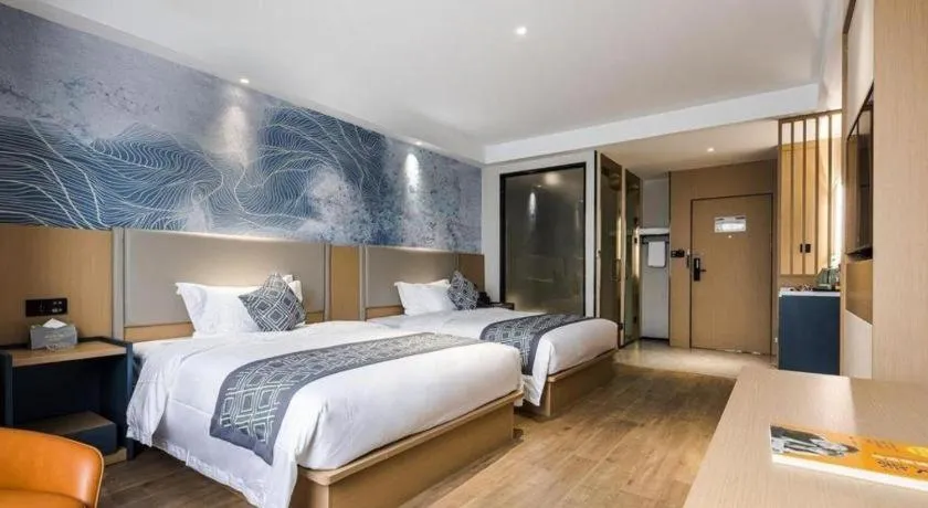 Bed in GEM Hotel Changzhou Xuejia'aoyuan North High-Speed Railway Station