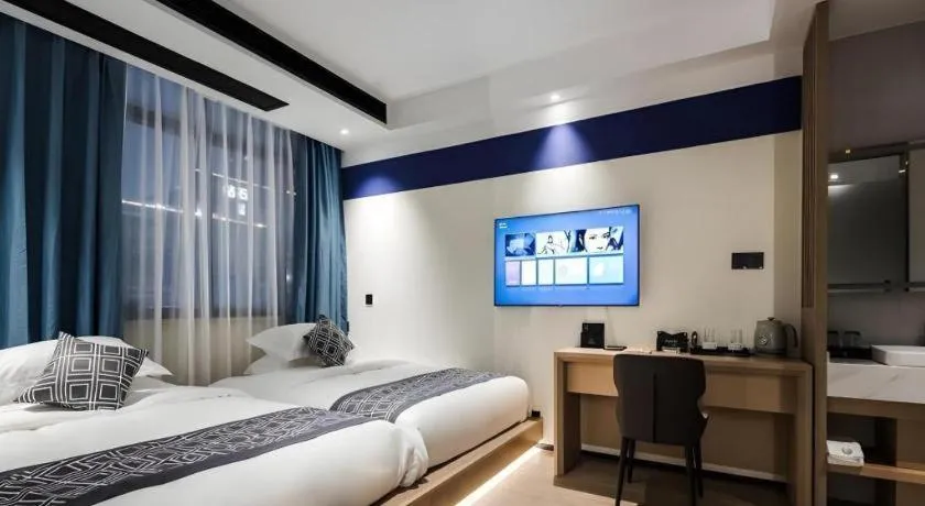 Bed in GEM Hotel Changzhou Xuejia'aoyuan North High-Speed Railway Station