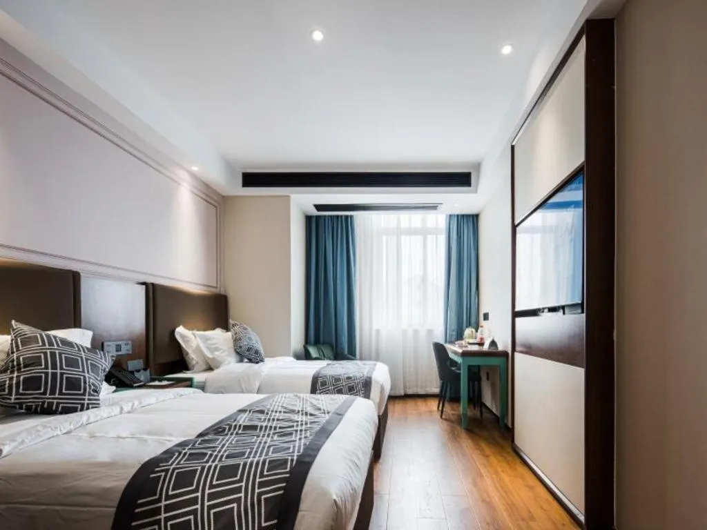 Bed in GEM Hotel Changzhou Xuejia'aoyuan North High-Speed Railway Station