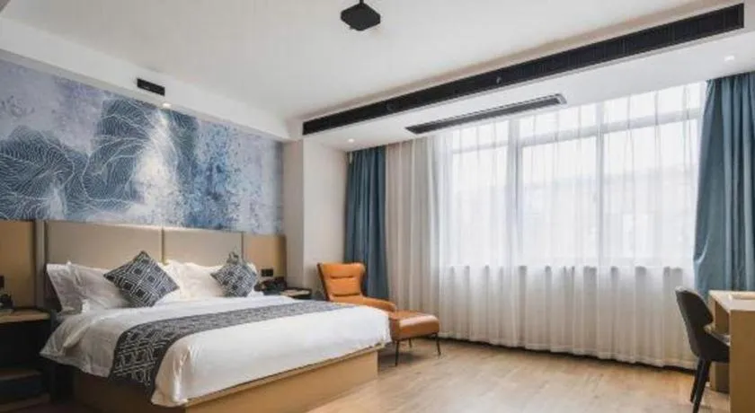 Bed in GEM Hotel Changzhou Xuejia'aoyuan North High-Speed Railway Station