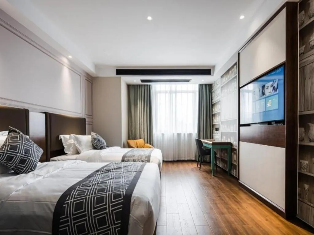 Bed in GEM Hotel Changzhou Xuejia'aoyuan North High-Speed Railway Station