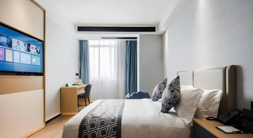 Bed in GEM Hotel Changzhou Xuejia'aoyuan North High-Speed Railway Station