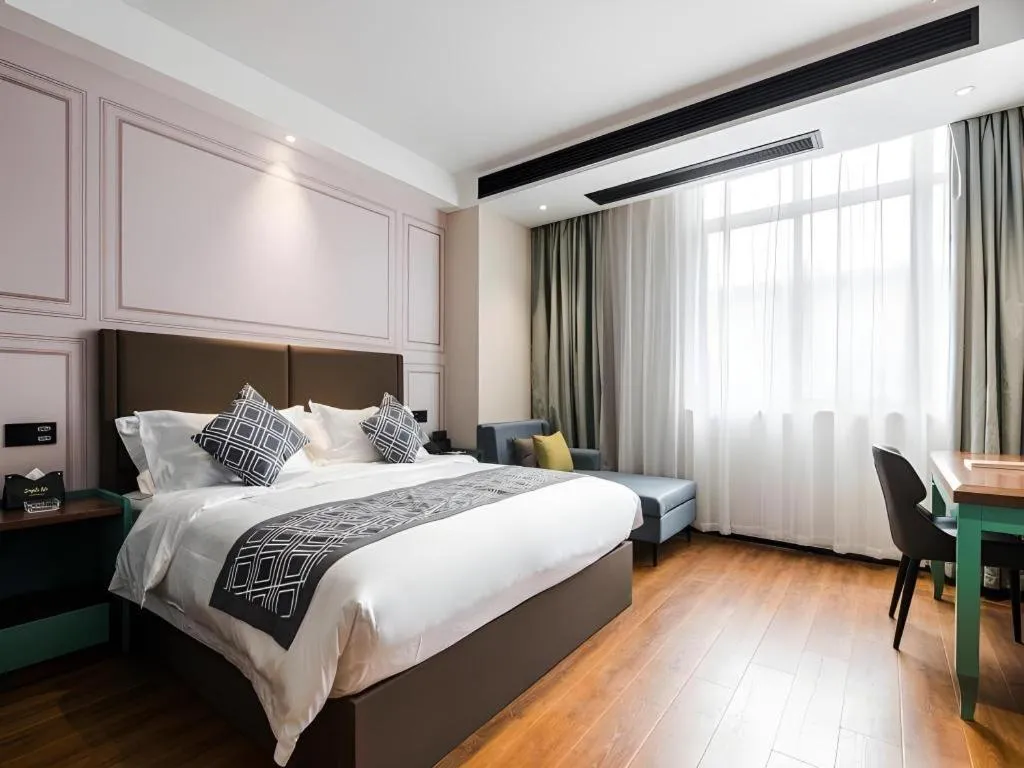 Bed in GEM Hotel Changzhou Xuejia'aoyuan North High-Speed Railway Station