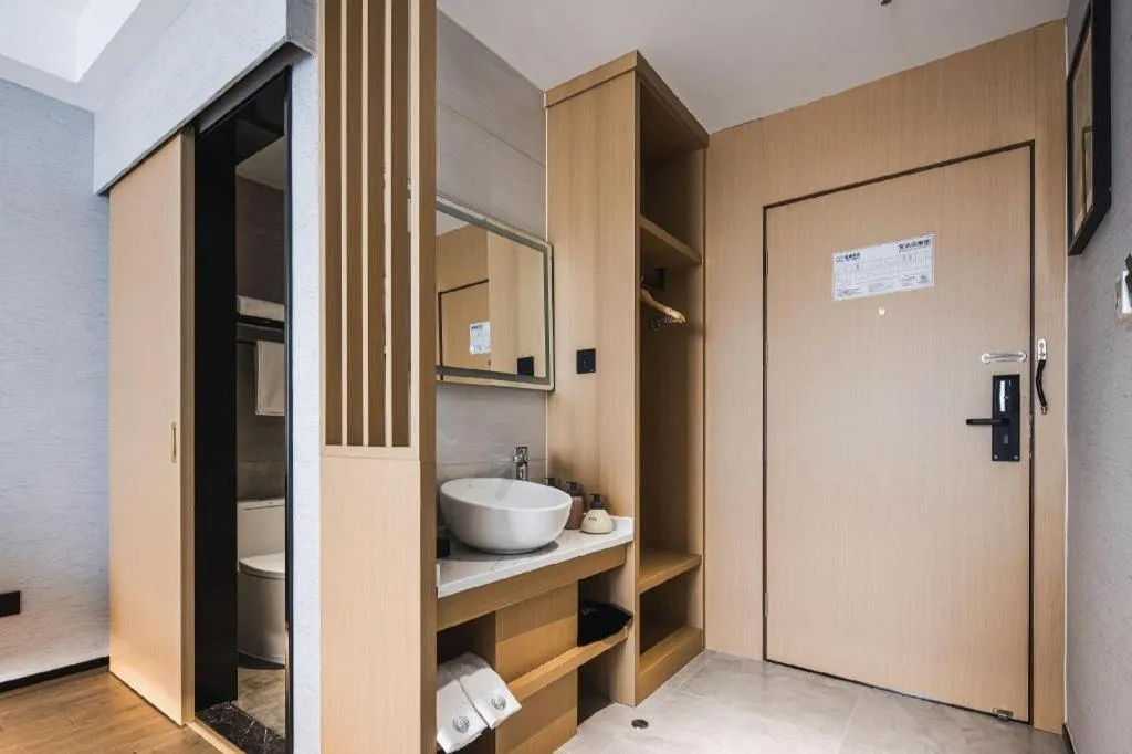 Bed in GEM Hotel Changzhou Xuejia'aoyuan North High-Speed Railway Station