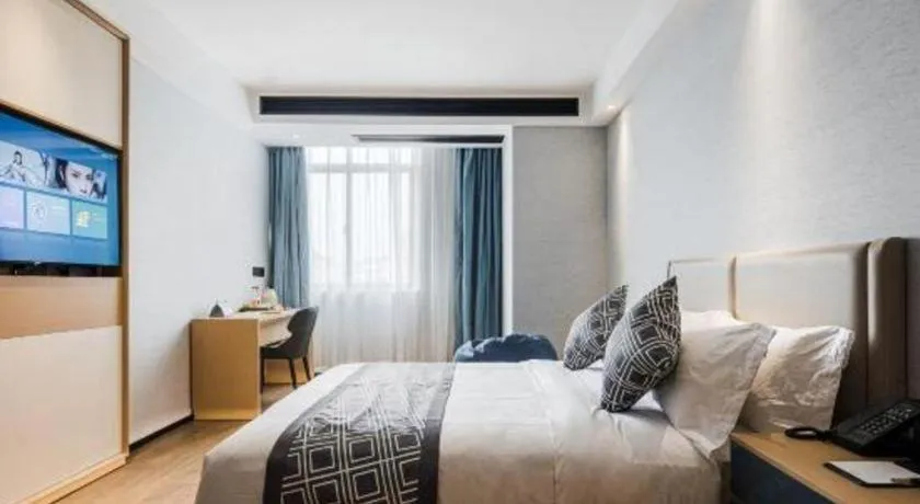 Bed in GEM Hotel Changzhou Xuejia'aoyuan North High-Speed Railway Station