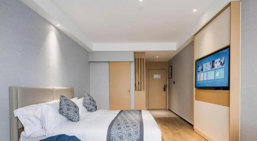 Bed in GEM Hotel Changzhou Xuejia'aoyuan North High-Speed Railway Station