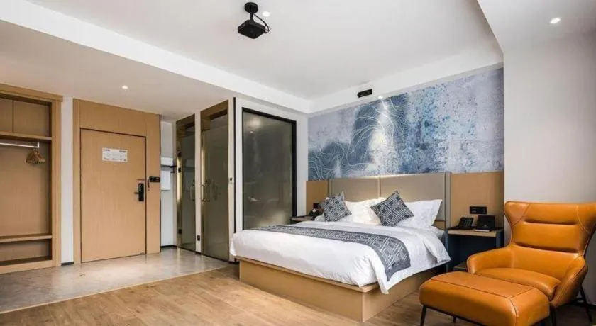 Bed in GEM Hotel Changzhou Xuejia'aoyuan North High-Speed Railway Station