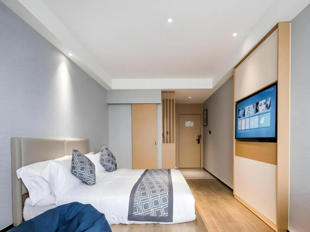 Bed in GEM Hotel Changzhou Xuejia'aoyuan North High-Speed Railway Station