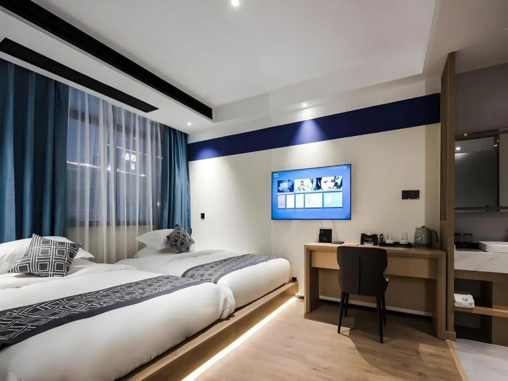 Bed in GEM Hotel Changzhou Xuejia'aoyuan North High-Speed Railway Station