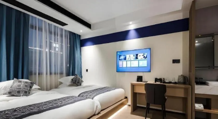 Bed in GEM Hotel Changzhou Xuejia'aoyuan North High-Speed Railway Station