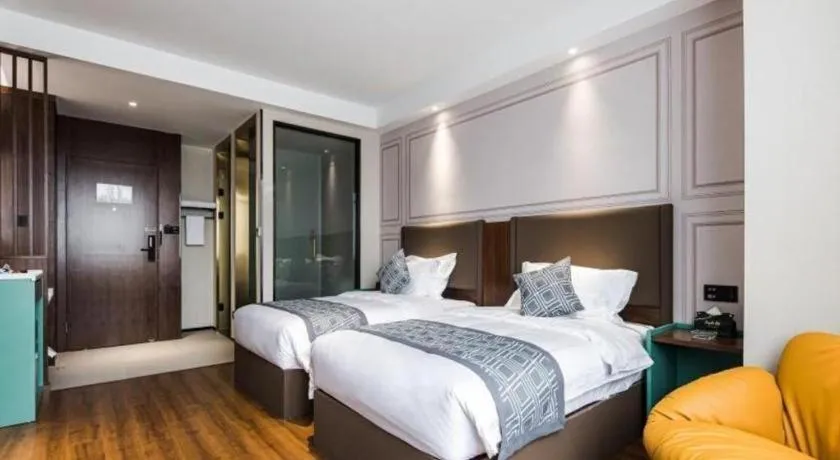Bed in GEM Hotel Changzhou Xuejia'aoyuan North High-Speed Railway Station
