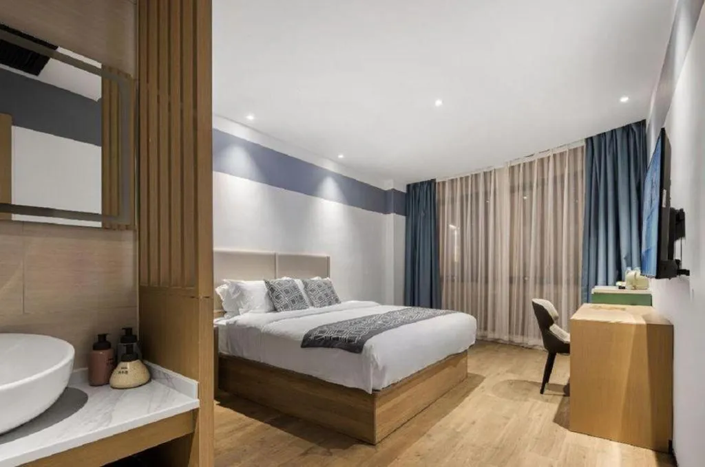 Bed in GEM Hotel Changzhou Xuejia'aoyuan North High-Speed Railway Station