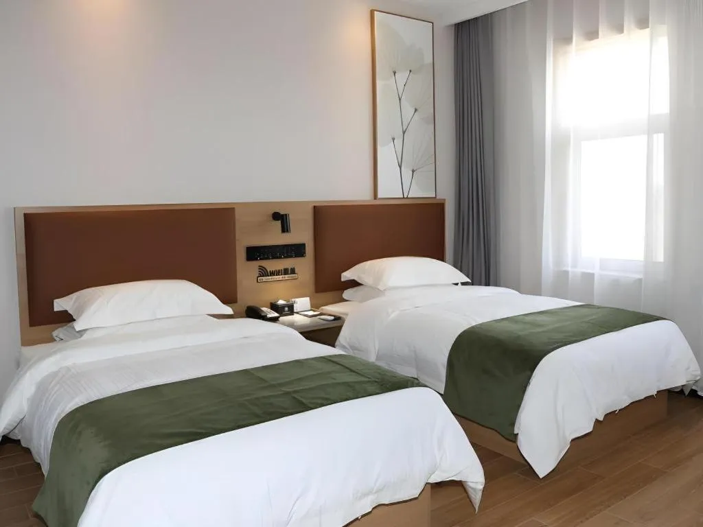 Bed in Green Tree Inn Express Inner Mongolia Ulan Qab High-Speed Railway Station