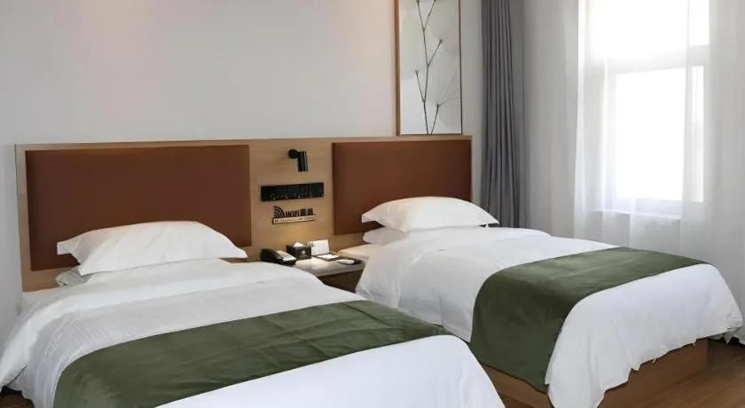 Bed in Green Tree Inn Express Inner Mongolia Ulan Qab High-Speed Railway Station