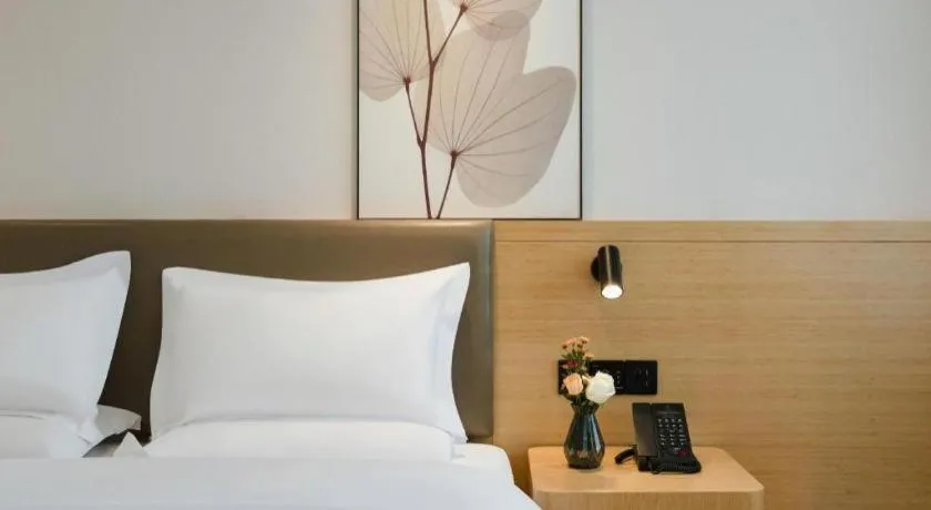 Bed in Green Tree Inn Xuzhou Tongshan Wanda Plaza Yuquanhe Metro Station